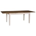 Moderne uitschuifbare rechthoekige tafel die op maat gemaakt kan worden. De kleur van het onderstel is de kleur vanille en de kleur van het tafelblad is wax finish - warm bruin. Villa Laura