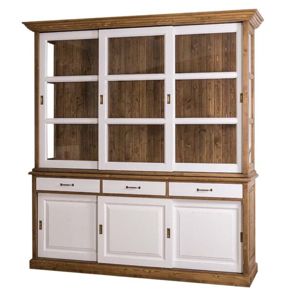 Landelijke buffetkast met zes schuifdeuren en drie lades. De onderkant van de kast zie je 3 schuifdeuren met daarboven 3 lades. De bovenkant van de kast heeft drie lange schuifdeuren met glas. Gemaakt van massief eiken hout in de kleur wax finish bruin met witte deuren en lades. De buffetkast kan op verschillende manieren geverfd worden in verschillende kleuren en kan op maat gemaakt worden. Villa Laura