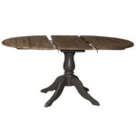 Landelijke uitschuifbare ronde eettafel met een klassiek onderstel. Eettafel gemaakt van eikenhout. Onderstel in de kleur zwartbruin en het tafelblad in de kleur koffie. Villa Laura